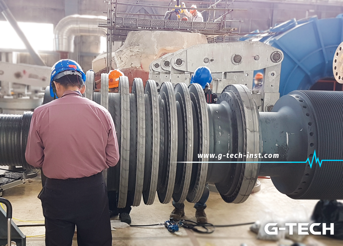 Image of a G-TECH engineer working on a large turbine